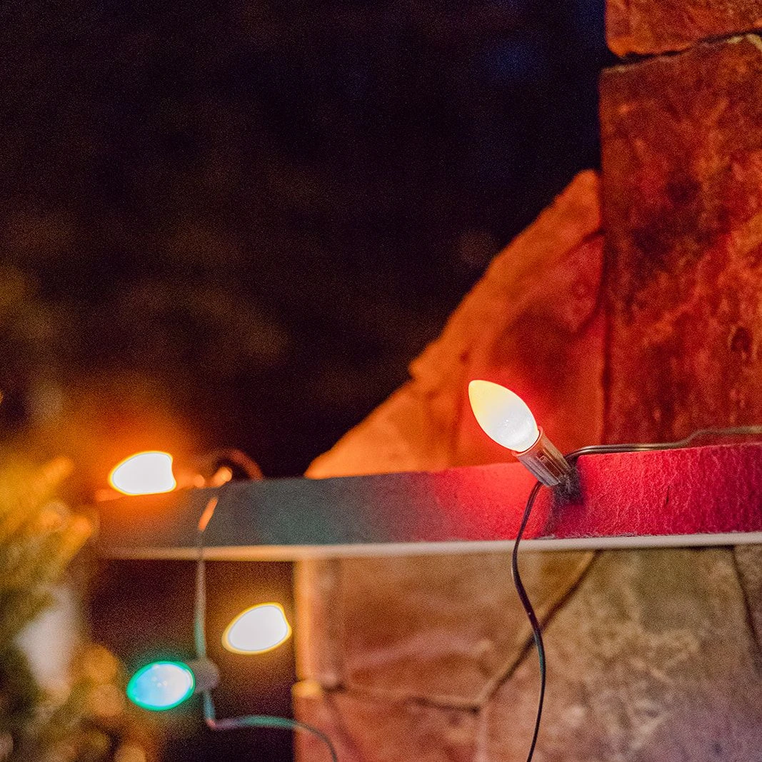 christmas lights on stone wall