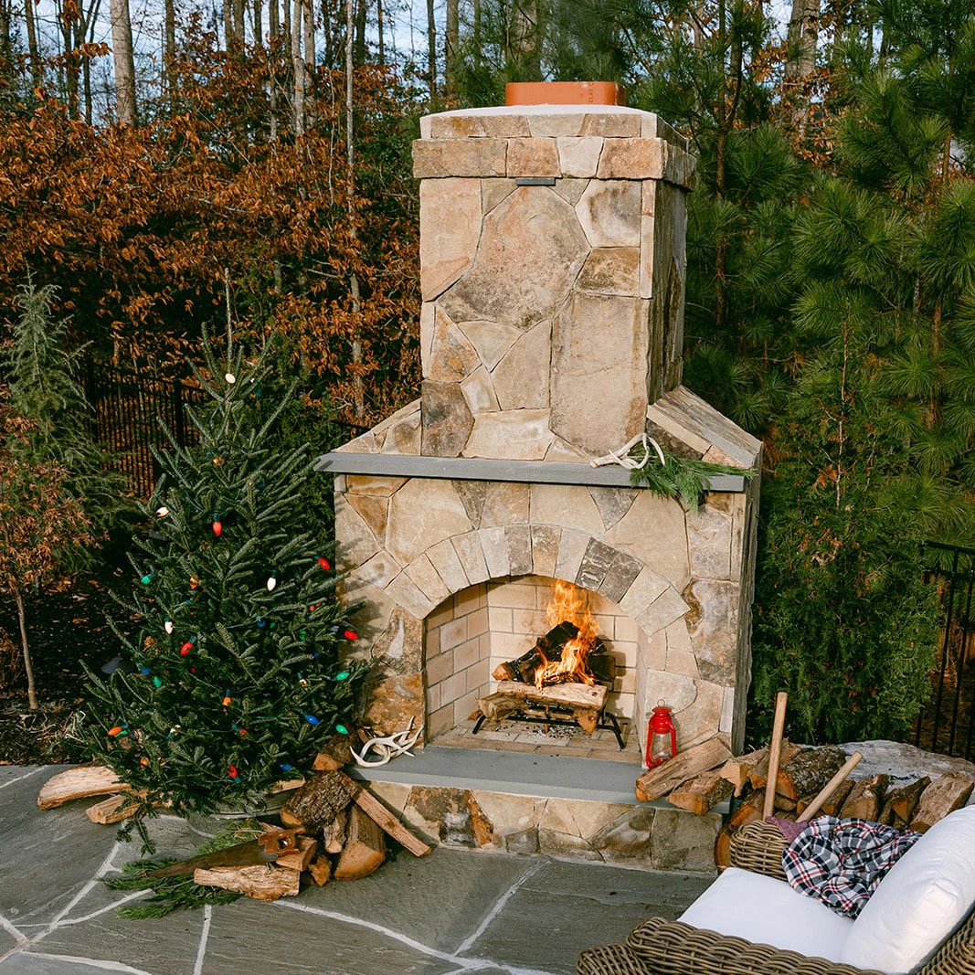 Nature-inspired Christmas patio design with fire feature