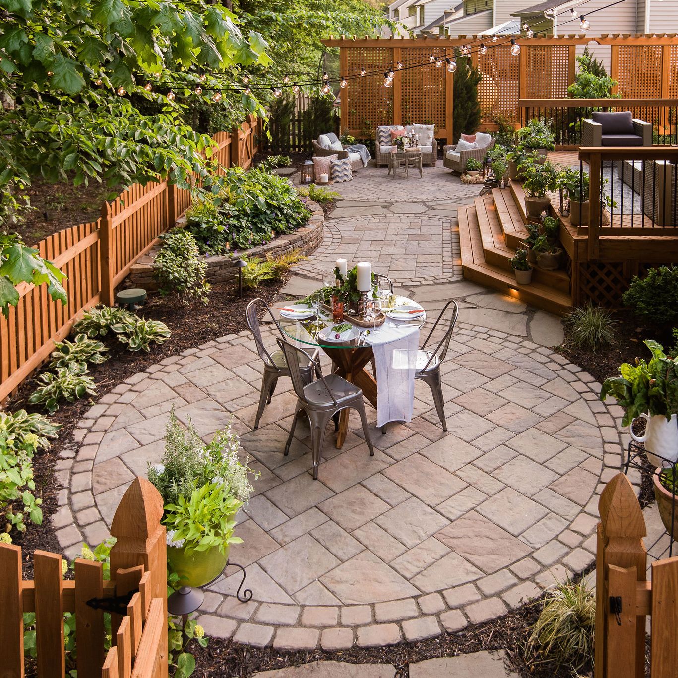Paver patio with deck and landscaping