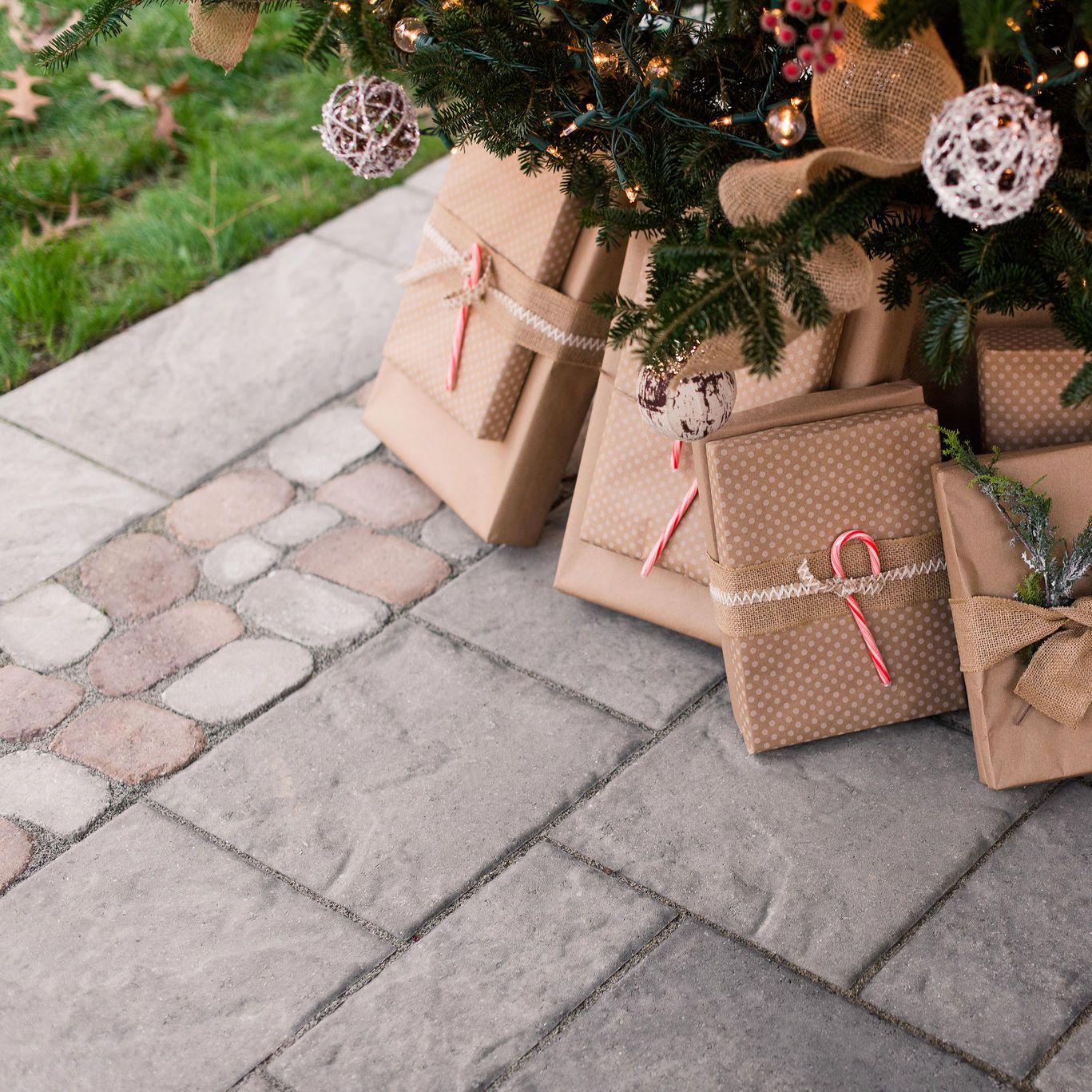 stone paver patio with presents under Christmas tree