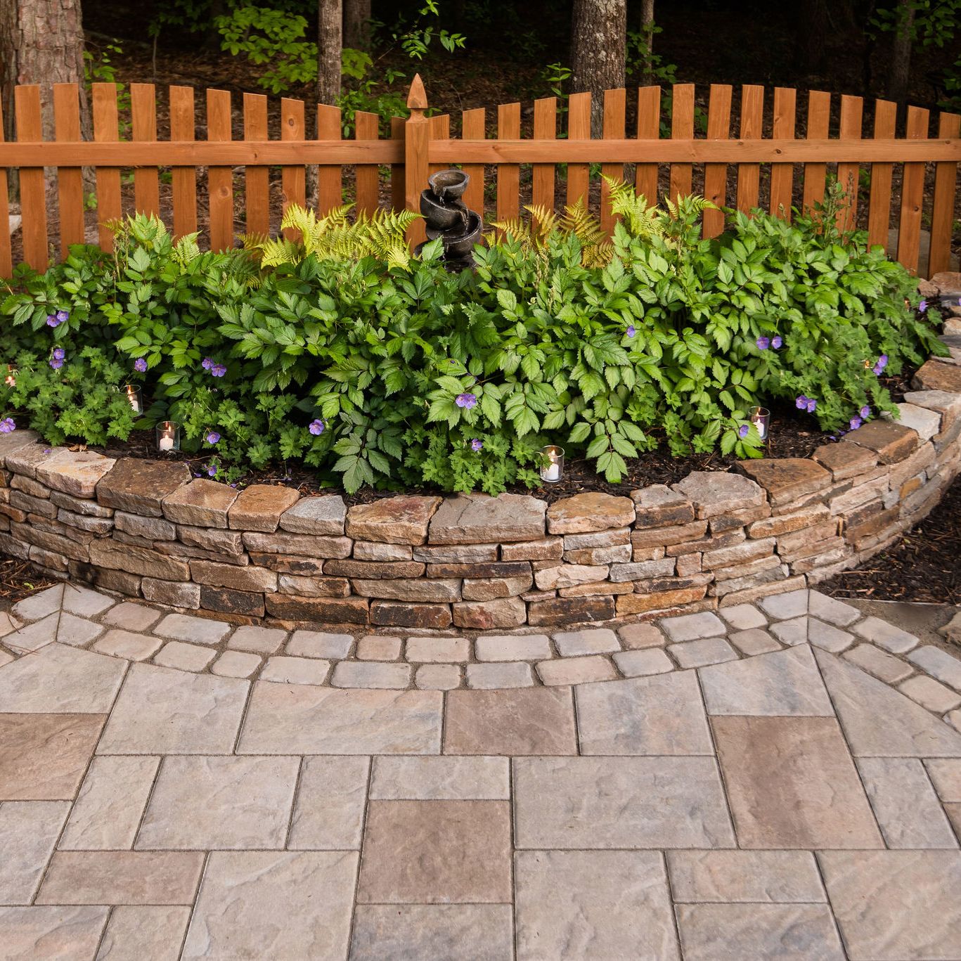 Natural stone stacked stone wall with landscaping