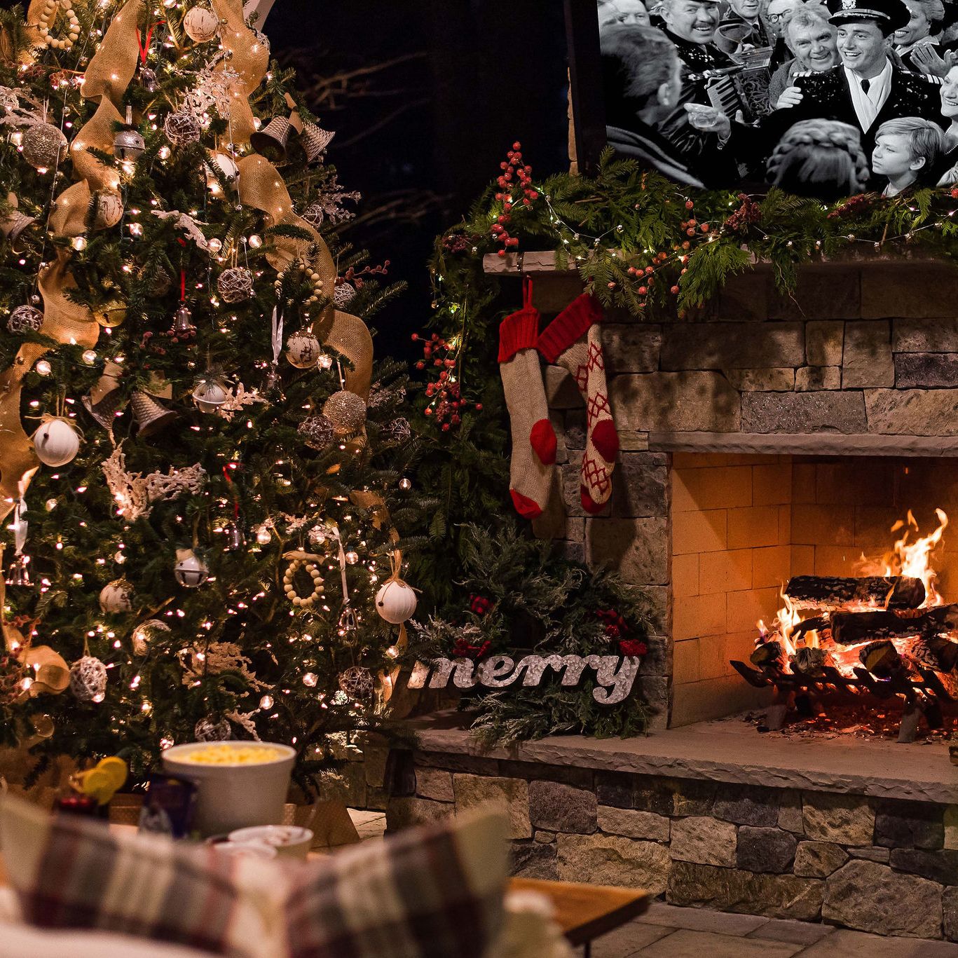Christmas decorations by outdoor fireplace