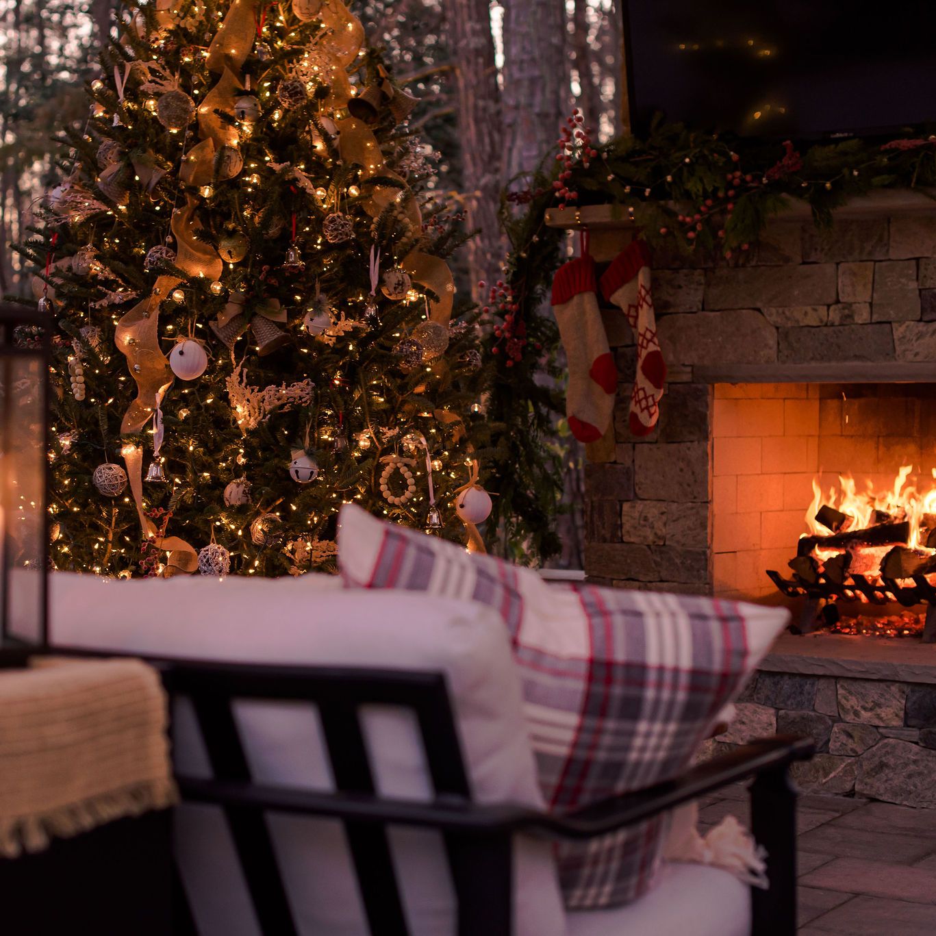 outdoor seating with stockings hanging on outdoor fireplace