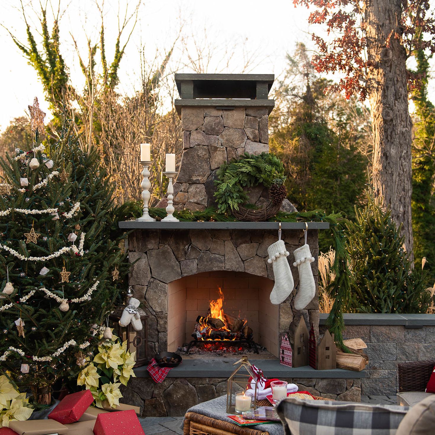 Christmas-themed outdoor lounge with fireplace