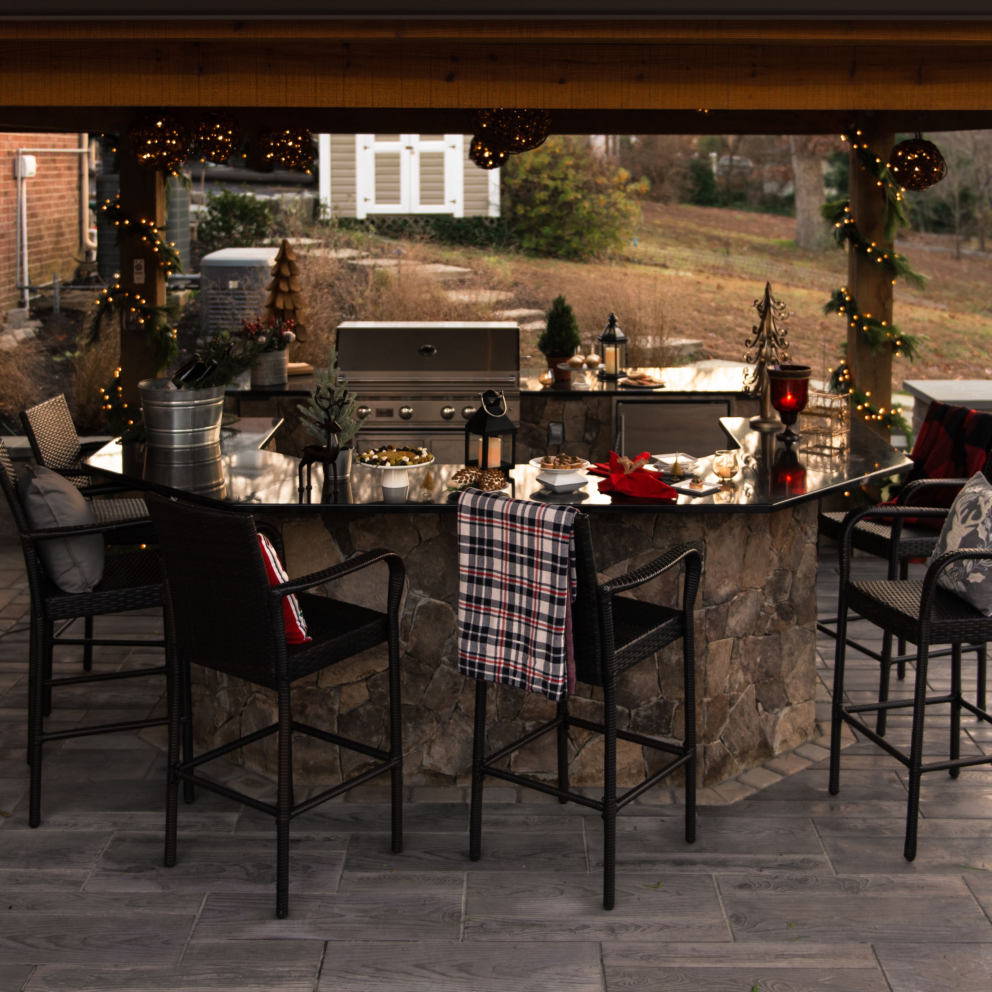 Festive pavilion covered kitchen decorated with greenery and wreaths